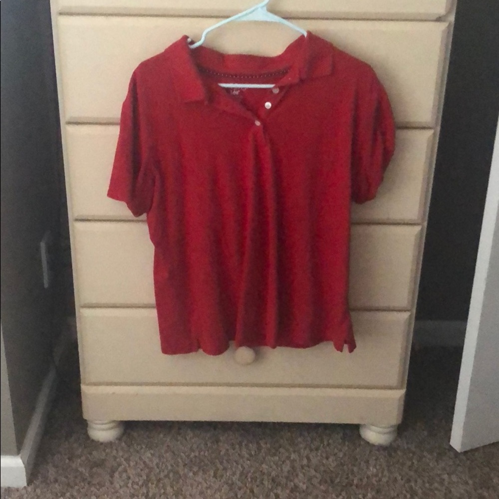 Red collared shirt.